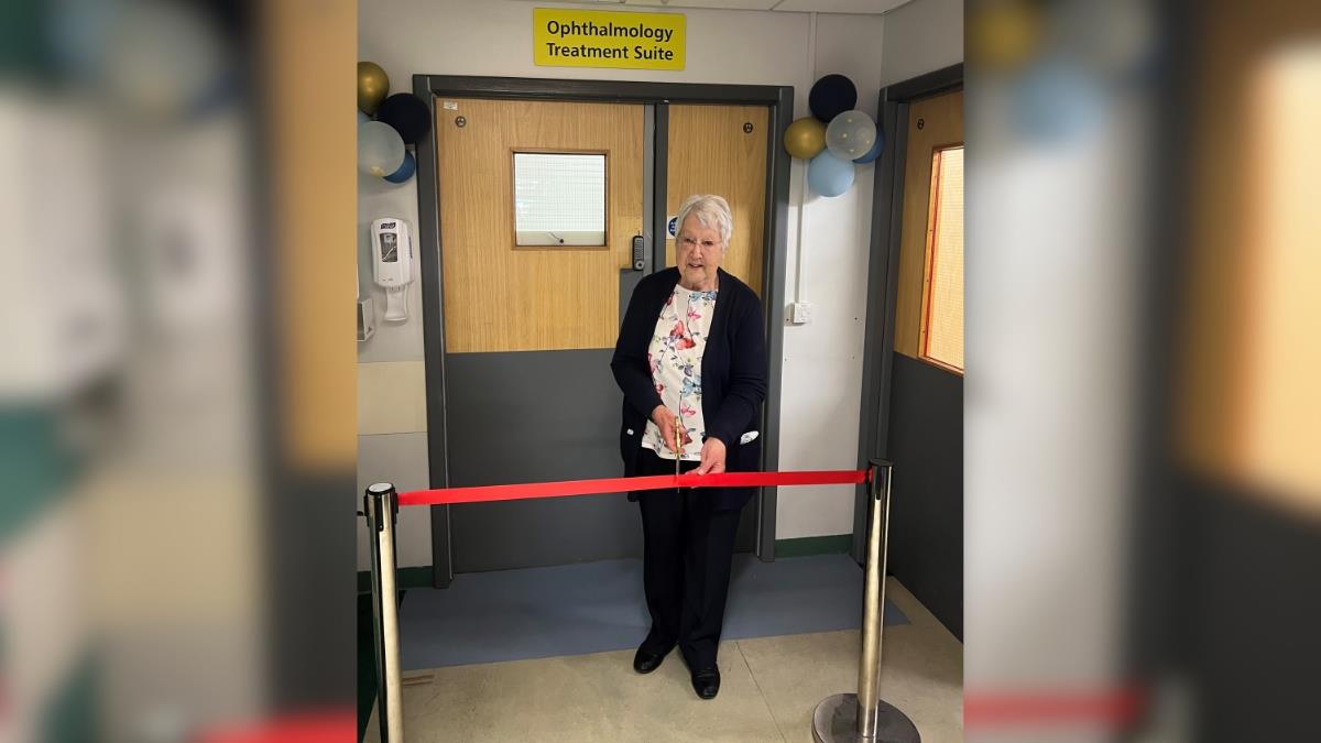Long-standing patient, Isobelle Ford, cuts the ribbon in front of the new unit.